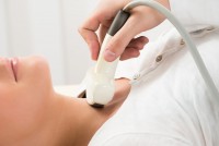 Woman Gets Ultrasound Of The Thyroid From Doctor